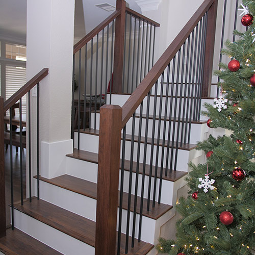 a wooden staircase next to a christmas tree round rock tx