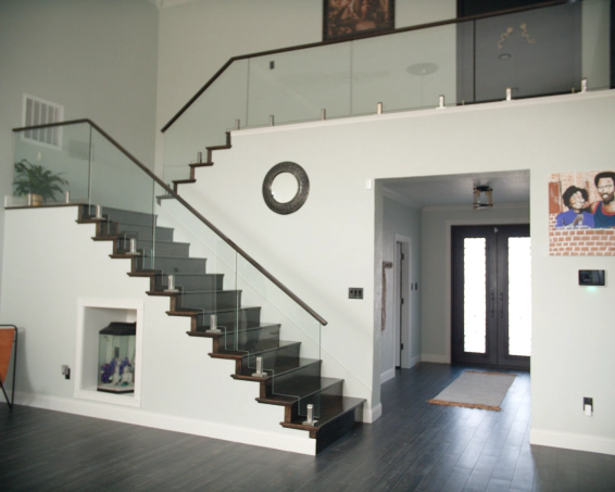home with glass railing along staircase to second floor round rock tx