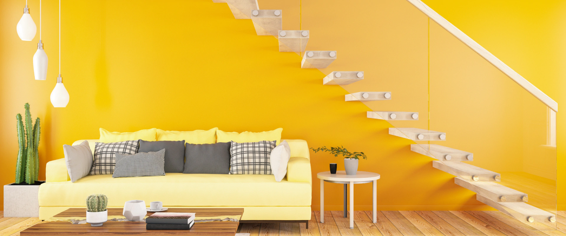 hero yellow wall and couch under floating stairs