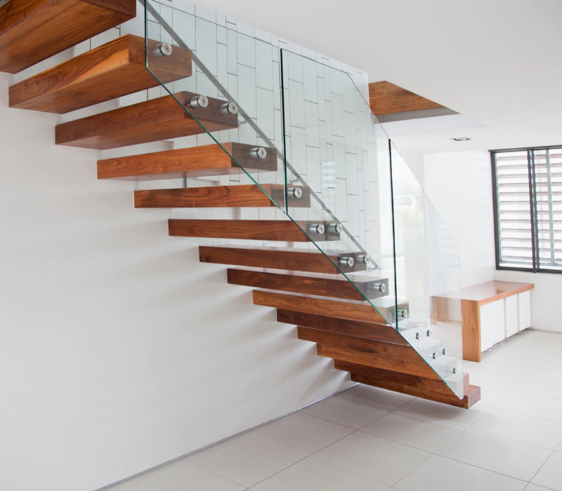 wooden steps and glass side of floating stairs